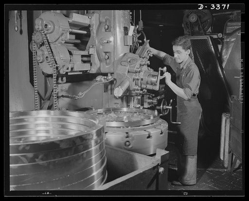 Bofors forty-millimeter mounts. The machine of bronze rings gears for the production of Bofors forty-millimeter anti-aircraft guns mounts and carriages at a large Midwest rubber factory involves skilled precision operations. Here an expert workman is making the final cut on a vertical turret lathe. 