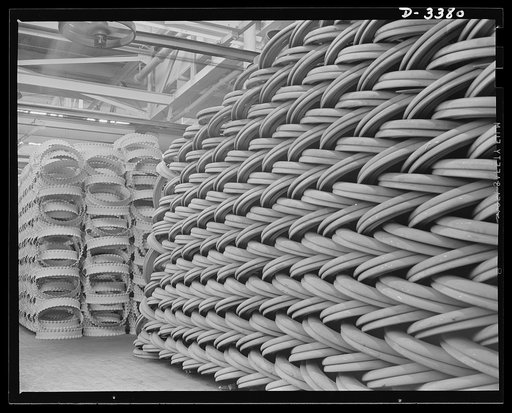Conversion. Army truck parts. Rings and rims, piled to the ceiling in a large Midwest rubber factory now converted to production of war essentials. The spacer rings (left) and the side rings (right) are used for Army transports and supply trucks