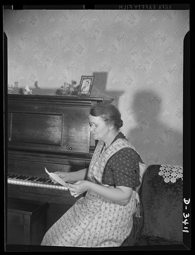 Women at war (Mrs. Smuda). "Dear Mom...." A letter from her youngest son, far away at camp, highlights the day for war worker Eva Smuda. Like son, like mother, they're both giving every bit of energy to help Uncle Sam defeat the Axis