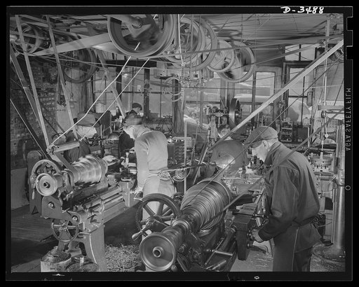 Conversion. Toy furniture to dies for incendiary bombs. Founded in 1900, this small Midwest machine shop is busy today with defense work. Note overhead power-driven belts, which, though obsolete, are still producing full speed ahead. Sivon Machine Company, Painesville, Ohio