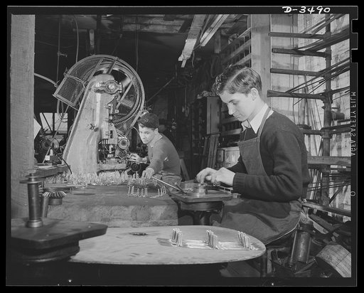 Conversion. Toy furniture to dies for incendiary bombs. This small Midwest machine shop used to manufacture doll's furniture and fly swatters before Pearl Harbor. Subcontracts on defense orders now occupy all machines as rapidly as the old stock can be assembled. Here two high school boys complete m