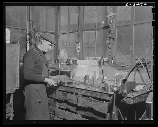 Conversion. Toy furniture to dies for incendiary bombs. This worker in a small Midwest factory is handling dies for use in producing incendiary bombs. The company, which formerly made doll's furniture, is now operating under subcontract for war production Sivon Machine Company, Painesville, Ohio
