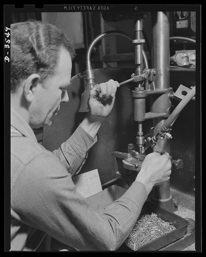 Conversion. Watch cases to war production. Volunteers for Victory. The fine machinery and skilled operators of a commercial watch case factory are now producing precision radio parts for the armed forces. Wadsworth Watch Company, Louisville, Kentucky