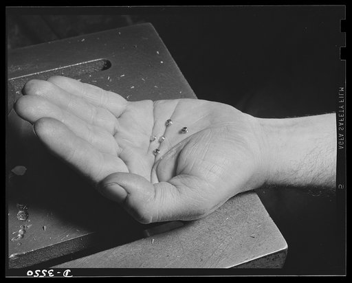 Conversion. Watch cases to war production. Little giants. Tiny fuse baffles, vital to victory, are produced for the Picatinny Arsenal in a Kentucky plant that formerly made watch cases. Wadsworth Watch Company, Louisville, Kentucky