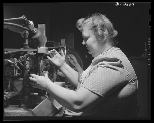 Conversion. Watch cases to war production. Converted for victory. The same machine and operator that were producing watches not long ago are now making precision radio parts for our armed forces