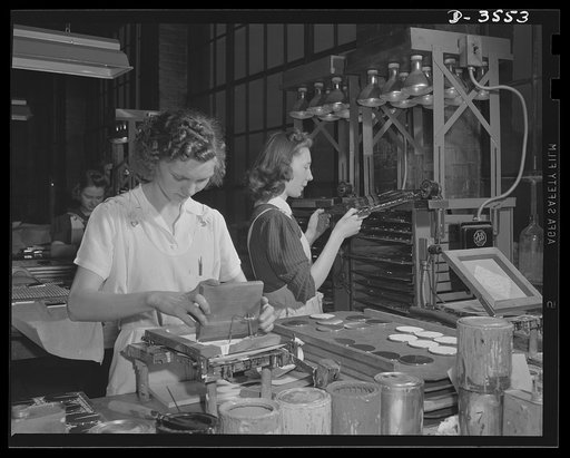 Conversion. Watch cases to war production. Compacts out, war production in. One of the last batches of luxury items is put through a Kentucky watch case plant now engaged in the production of gun parts, fuse baffles, compass cases and other essentials for our fighters. Wadsworth Watch Company, Louis