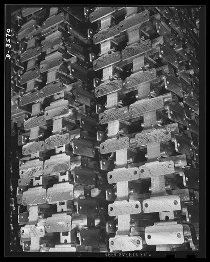 Conversion. Cash registers to gun magazines. Mouthpiece forgings all ready for assembly in the magazines of 20mm anti-aircraft guns. A well known cash register manufacturer produced them in a large volume. National Cash Register Company, Dayton, Ohio