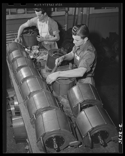 Oerliken magazines for 20mm anti-aircraft guns go through final assembly operations in the plant of a former manufacturer of cash registers. National Cash Register Company, Dayton, Ohio