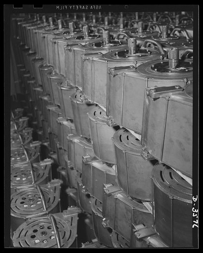 Oerliken magazines for 20mm anti-aricraft guns ready for shipment from a converted cash register plant in which they were made. National Cash Register Company, Dayton, Ohio