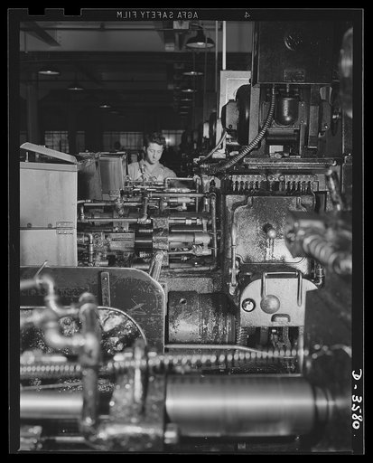 A multiple spindle screw machine on 20mm fuse production in a plant that formerly made cash registers. National Cash Register Company, Dayton, Ohio