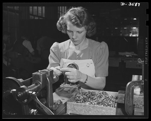 Conversion. Cash registers to gun magazines. A boring operation on the Oerliken machine for 20mm anti-aircraft guns. Many regular employees were retained when a large cash register manufacturing plant changed over to war production. National Cash Register Company, Dayton, Ohio