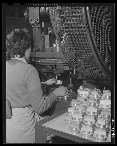 Conversion. Cash registers to gun magazines. Marking M-48 fuse bodies on the production line of a large cash register factory now engaged in the making of essential war equipment. National Cash Register Company, Dayton, Ohio