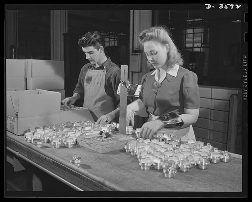 Conversion. Cash registers to gun magazines. Women work side by side with men to smash the Axis. Arming test of M-48 fuse bodies part of the routine inspection of shell parts at a former cash register factory now engaged in war production. National Cash Register Company, Dayton, Ohio