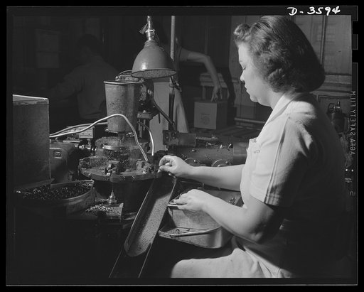 Conversion. Cash registers to gun magazines. A special machine drills and reams holes in relay lighting charge housings for 37mm shells. The work is done in a converted cash register factory. National Cash Register Compnay, Dayton, Ohio