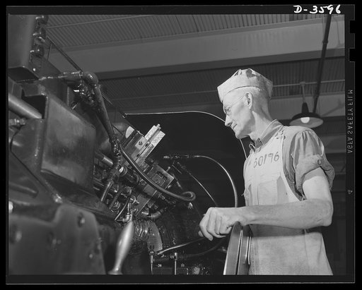 Conversion. Cash registers to gun magazines. A multiple spindle screw machine and a highly skilled machinist ensure high production of M-48 fuse bodies as a converted cash register plant goes into war production. National Cash Register Company, Dayton, Ohio