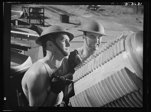 Fort Story coast defense. A tough job for soldiers: shoving the breech block of the giant howitzer into place. The screw threads help the block to withstand millions of foot pounds of pressure caused by the exploding charge