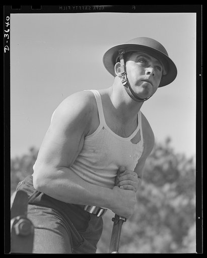 Fort Story coast defense. Perfect timing is required of this soldier who operates the adjusting lever on one of Fort Story's giant guns