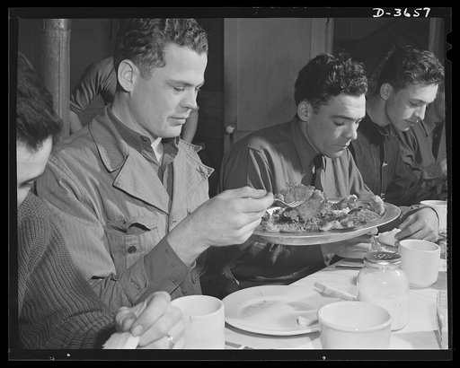 Fort Story coast defense. It may not be exactly like home cooking, but you'd never guess by the appetites of these soldiers at Fort Story, Virginia