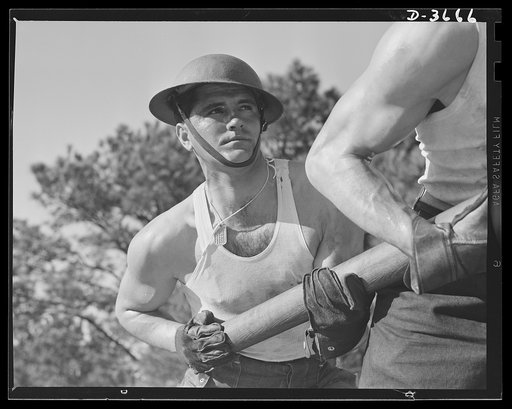 Fort Story coast defense. It takes plenty of muscle to swab out the inside of one of Fort Story's giant guns after a charge has been fired