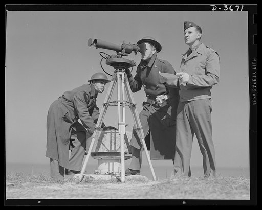 Fort Story coast defense. Men at Fort Story, Virginia operate an azimuth instrument to measure the angle of splash in sea-target practice