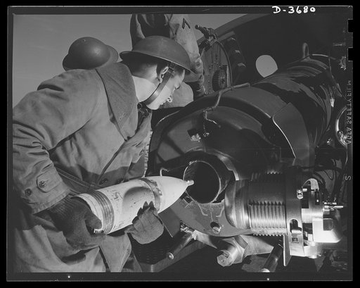 Fort Story coast defense. Projectile being loaded into an interrupted-screw type breech at Fort Story, Virginia. With a quarter turn, this breech gives the same sealing effect as twelve turns on a regualr screw