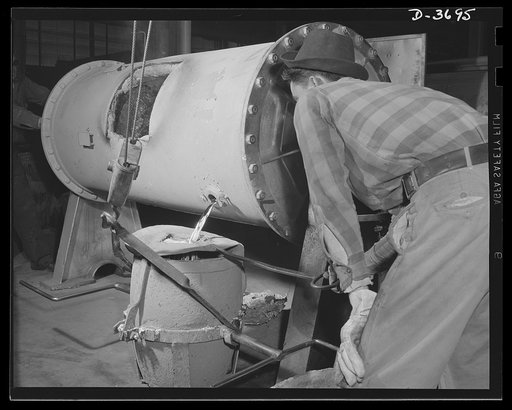 One of the many intricate performances necessary to the production of aluminum parts for Uncle Sam's mechanized army involves tapping metal from a 1000 pound rotary furnace into a 300 pound carrying pot. Aluminum Industries