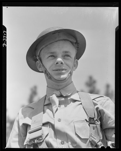 Mrs. Smuda's son. Private Edwin Smuda of Frankford, Pennsylvania, one of Uncle Sam's fighting men, now at camp "somewhere in the South." Like many another U.S. soldier, Private Smuda has a mother who is working just as steadfastly for Victory as he is. Mrs. Smuda tapes cartridge cases at the Frankfo