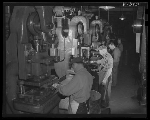 Where the jeeps come from. A row of Fericute presses in a plant that had produced high-priced automobiles is now stamping out small parts for the tough little army machine. The parts are shipped to assembly plants all over the coutry. Ford Lincoln plant, Michigan