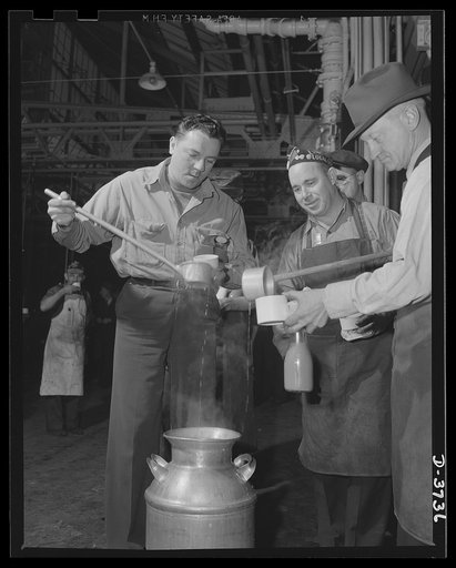 Soup line, 1942. Skilled workers, engaged in converting a huge automobile plant to army tank production, "freshen up" on an overtime job with hot soup and coffee. Ford Lincoln plant, Michigan