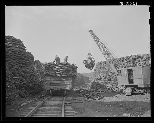 Rubber reclamation. Scrap tires mobilized for Victory. Millions of discarded casings cover more than 100 acres at one Midwest recovery plant. Systematic piling and sectional arrangement reduce fire hazard. Special processes will separate metal from the tires and tube bodies. The reclaimed material w