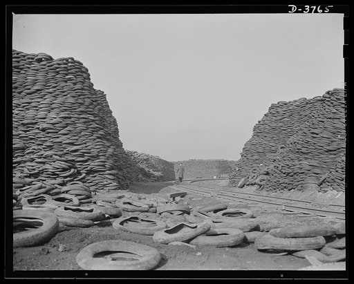 Rubber reclamation. Scrap tires mobilized for Victory. Millions of discarded casings cover more than 100 acres at one Midwest recovery plant. Systematic piling and sectional arrangement reduce fire hazard. Special processes will separate metal from the tires and tube bodies. The reclaimed material w