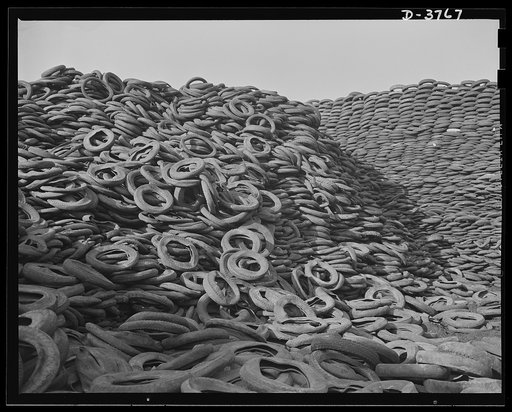 Rubber reclamation. Scrap tires mobilized for Victory. Millions of discarded casings cover more than 100 acres at one Midwest recovery plant. Systematic piling and sectional arrangement reduce fire hazard. Special processes will separate metal from the tires and tube bodies. The reclaimed material w