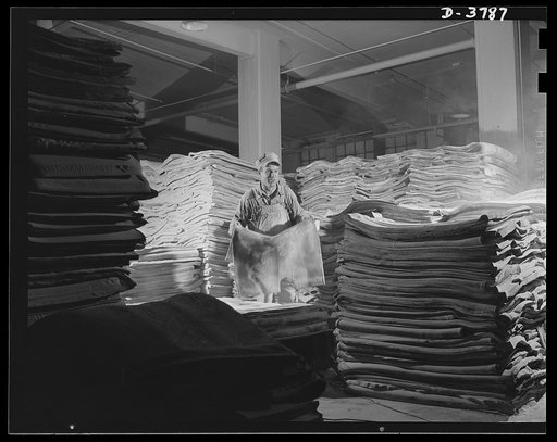 Rubber reclamation. Old tires transformed. A stockpile of reclaimed rubber in a big Midwest recovery plant employing the xylos process. The thick, heavy sheets are ready for processing into essential products not requiring virgin rubber. Firestone