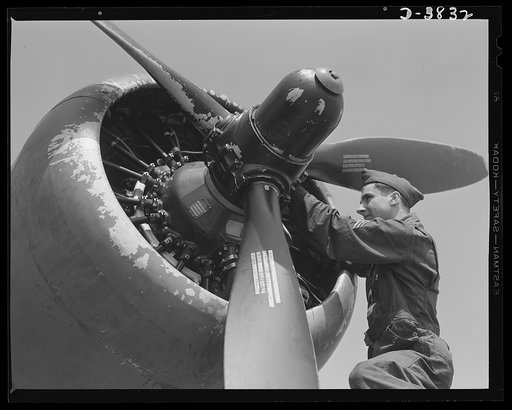 YB-17 bombardment squadron, Langley Field, Virginia. A propeller governor is adjsuted by a sergeant of a bombardment squadron at Langley Field, Virginia as part of the job of tuning up a mighty YB-17 bomber before it goes into the air