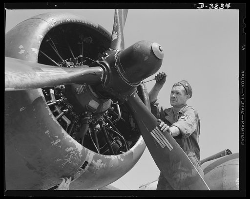 YB-17 bombardment squadron, Langley Field, Virginia. A master sergeant of a bombardment squadron at Langley Field, Virginia checks over a propeller adjustment job his soldier-mechanics have just made on a big YB-17 bomber
