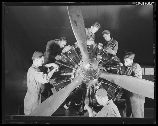YB-17 bombardment squadron, Langley Field, Virginia. The men who "keep 'em flying," a sergeant and five corporals of a bombardment squadron at Langley Field, Virginia complete a thorough overhaul job on one of the big Wright engines of a heavy bomber