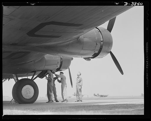 YB-17 bombardment squadron, Langley Field, Virginia. Skilled soldier-mechanics make up the ground crew personnel of a bombardment squadron stationed at Langley Field, Virginia. These men keep ships like the fast YB-17 bombers in the pink of condition