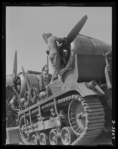 YB-17 bombardment squadron, Langley Field, Virginia. Top-notch performance of our big bombers is made a matter of certainty by the ground crews of the Air Force. A soldier-mechanic at Langley Field, Virginia makes an engine adjustment on a mighty YB-17 bomber under the critical eye of a sergeant