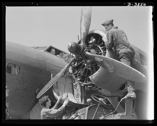 YB-17 bombardment squadron, Langley Field, Virginia. There isn't much these sodlier-mechanics don't know about big airplane engines. Non-coms of a bombardment squadron at Langley Field, Virginia install a ring cowling around one of the four powerful engines of a YB-17 bomber