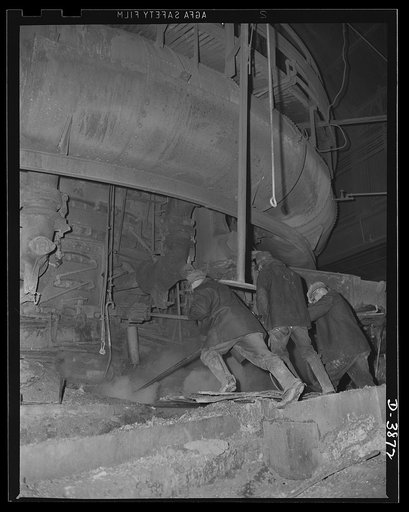 Steel production. More iron for victory. Furnace men drill a tapping hole out of a blast furnace to swell the record-breaking volume of metal at a large Eastern company that is producing steadily. Republic, Youngstown