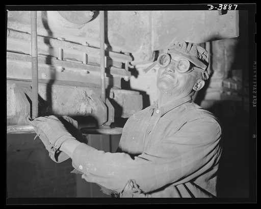 Steel Production. Worker at steel plant. A flue blower in a blast furnace boiler house performs an inportant duty. Republic, Youngstown