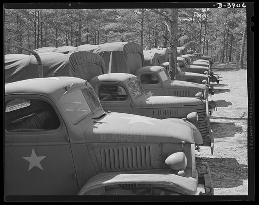 Fort Benning. Military trucks. Fast freighters of our motorized arm. Uncle Sam's new military trucks can do jobs that would astonish even the famous American army mule. They serve as troop carriers or as supply and ammunition trucks with the same high efficiency