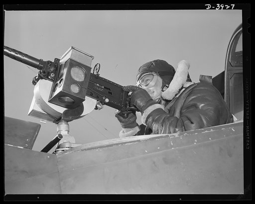 Fort Benning. Aerial machine gunners. Four aces. This crack aerial machine gunner is part of an unbeatable combination. He has a fast, accurate gun and the world's best in the way of plane and pilot