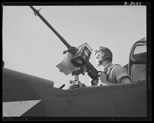 Fort Benning. Aerial machine gunners. This crack aerial machine gunner is part of an unbeatable combination. He has a fast, accurate gun and the world's best in the way of plane and pilot