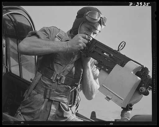 Fort Benning. Aerial machine gunners. Four aces. This crack aerial machine gunner is part of the unbeatable combination. He has a fast, accurate gun and the world's best in the way of plane and pilot