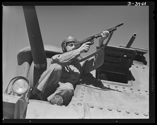 Fort Benning. Tommy gunners, armored forces. The tank soldier finds many chores for the Thompson sub-machine gun, familiarly known as the tommy gun