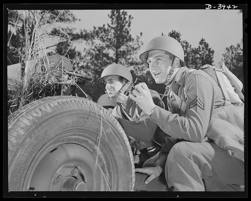 Fort Benning. Anti-tank gun crews. Whoa! That did it! An anti-tank gunner finishing at Fort Benning, Georgia has just made a bull's-eye