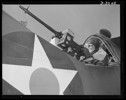 Fort Benning. Aerial machine gunners. Four aces. This crack aerial machine gunner is a part of an unbeatable combination. He has a fast, accurate gun and the world's best in the way of plane and pilot