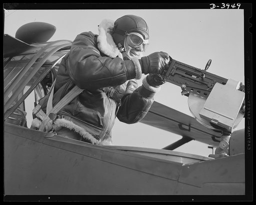 Fort Benning. Aerial machine gunners. Four aces. This crack aerial machine gunner is part of a an unbeatable combination. He has a fast, accurate gun and the world's best in the way of plane and pilot