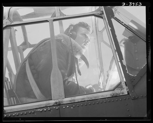 Fort Benning. Air corps pilots in training. An eaglet tries his wings. When this student pilot has completed his training course at Fort Benning, Georgia, the Army will have another good man who knows what it is all about